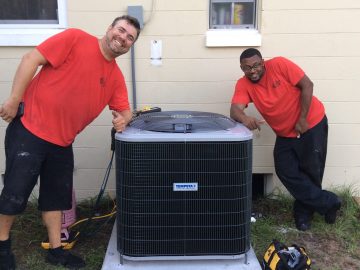 picture of technicians with an ac unit Ocoee FL